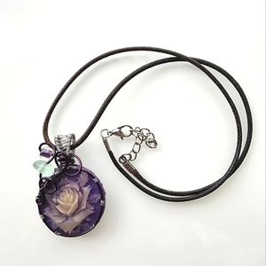 Glow-in-the-dark necklace. Handmade purple floral pendant & braided leather cord